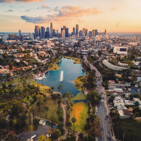 skyline of a city with a lake in the middle